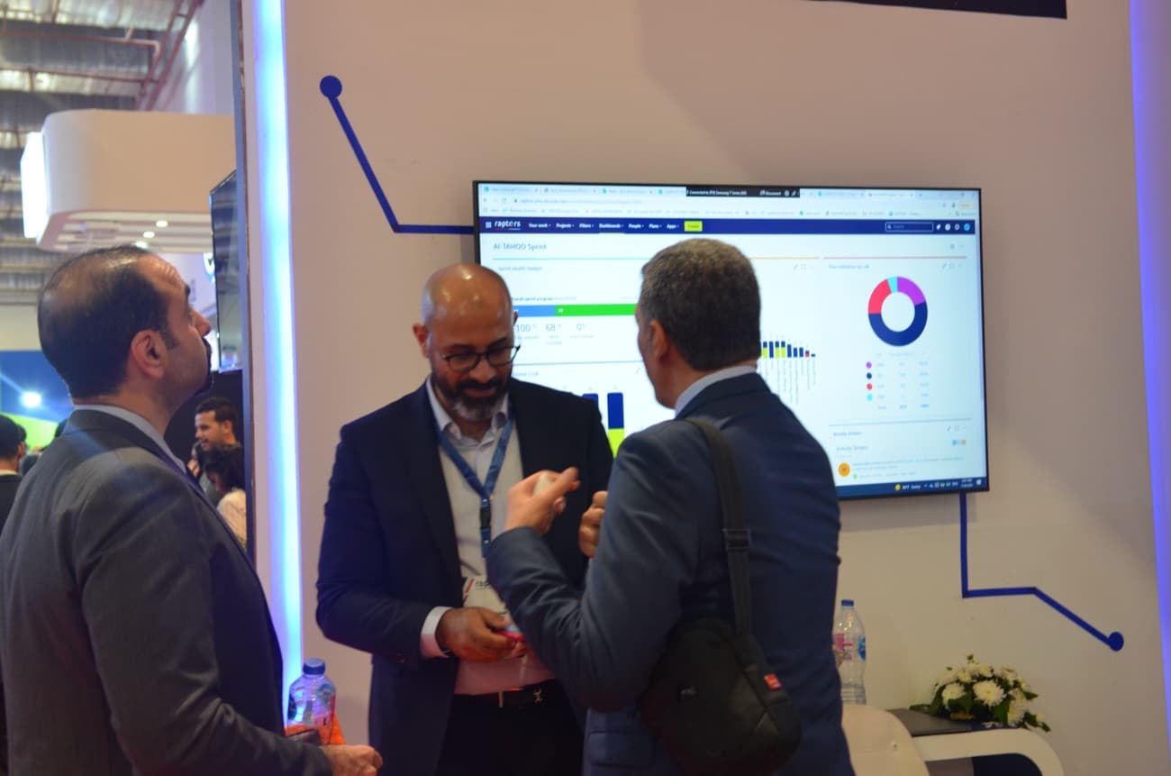 The team walking a visitor through a live analytics dashboard.